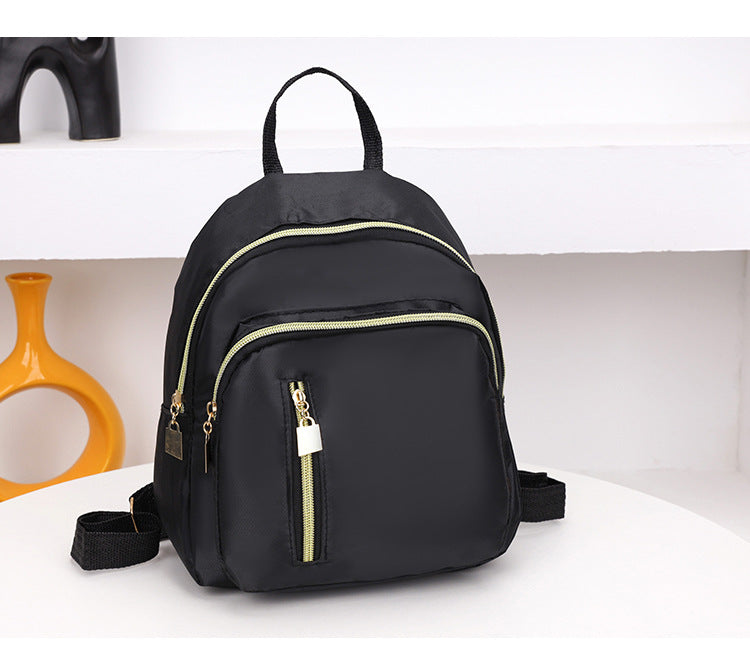 Women's Black Nylon Mini Backpack Casual Daypack with Gold Accent Zippers